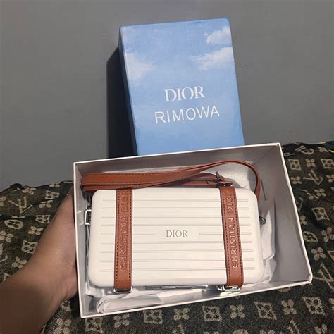 dior rimowa sling bag.